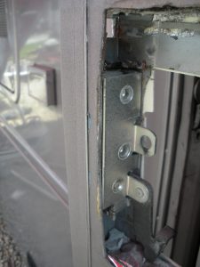 Latch mechanism installed into door, viewed from outside-facing side